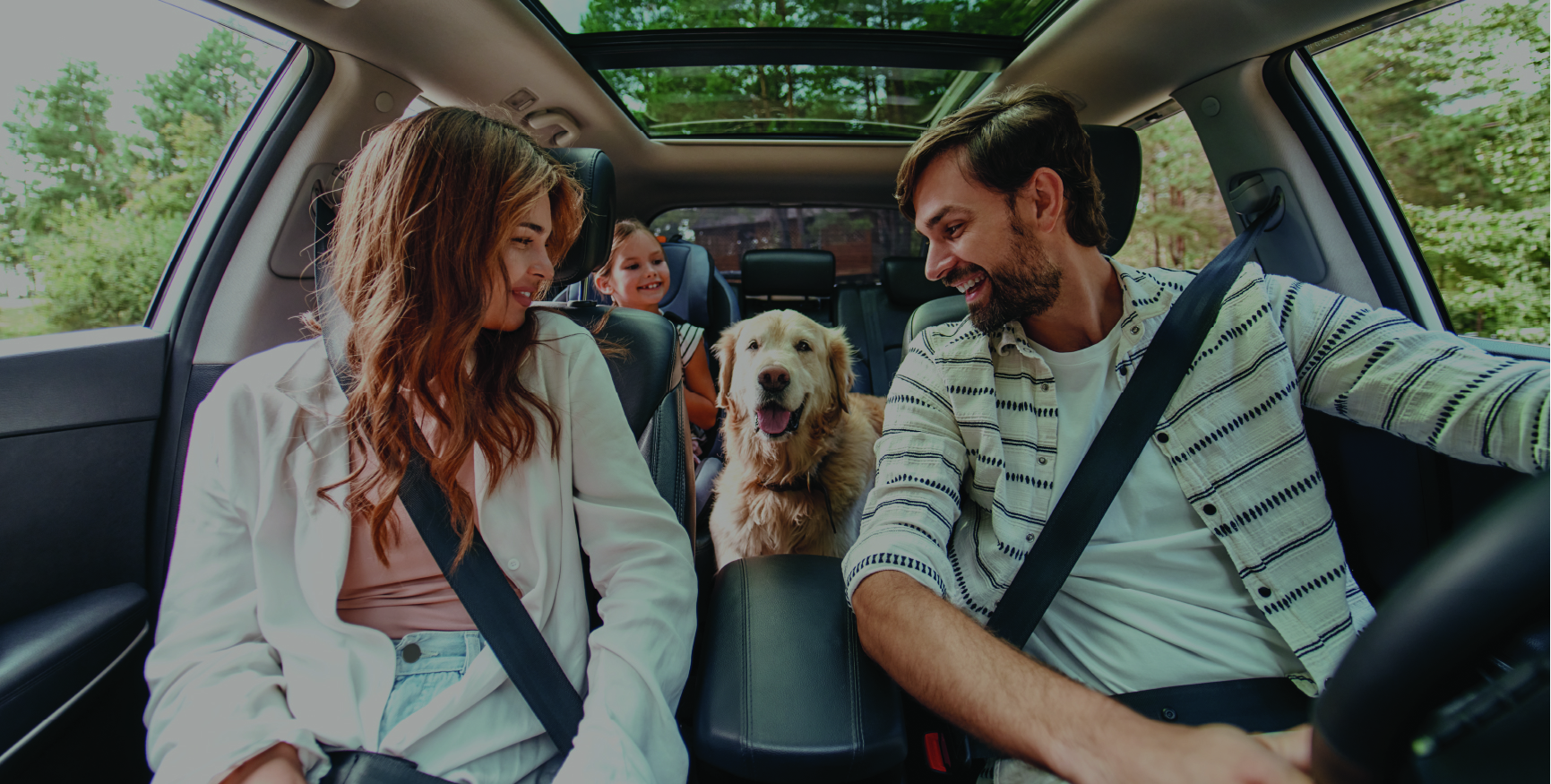 Woman and dog in their new car.